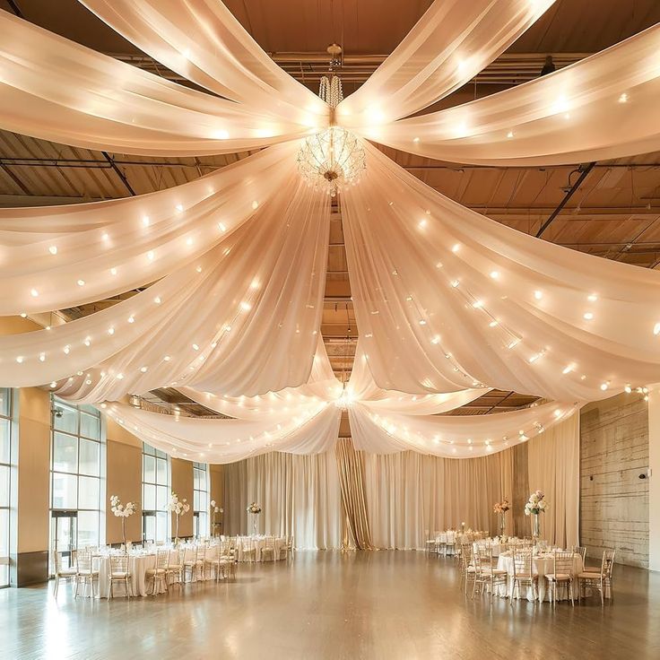 Wedding Decor Ideas That Look Luxurious on a Budget sheer ceiling draping fabric by decoor with mee