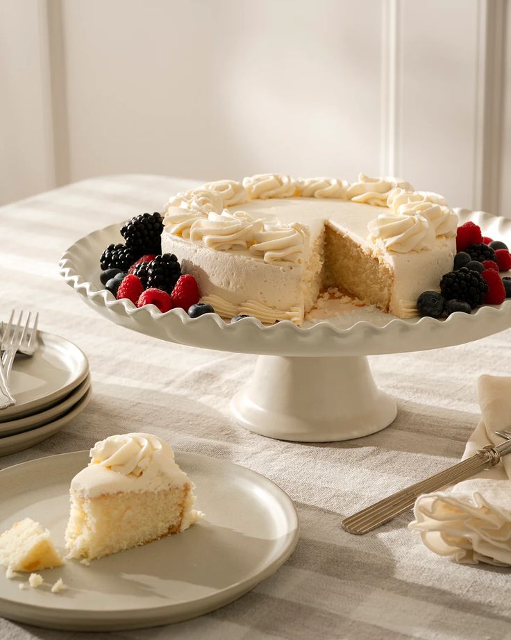 Wedding Decor Ideas That Look Luxurious on a Budget white ceramic cake stand set.